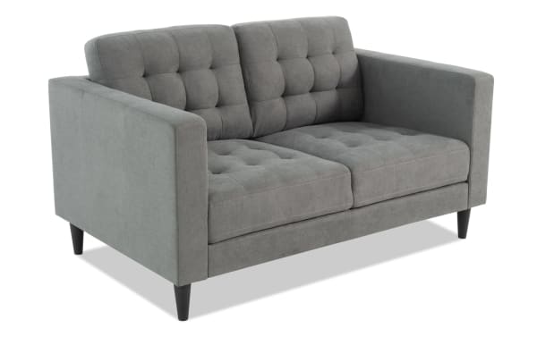 Metro Charcoal 57'' loveseat in gray polyester fabric with tufted cushions, track arms, and tapered legs, featuring a transitional style from the Metro collection.