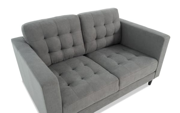 Metro Charcoal 57'' Loveseat in gray polyester fabric with tufted cushions, track arms, and transitional style from the Metro collection.