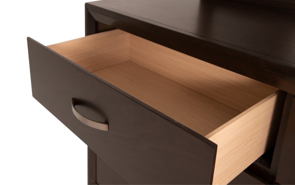 Open drawer of dark espresso MDF and rubberwood transitional dresser from Tremont 4 Piece Full Espresso & Gray Upholstered Storage Bedroom Set, showing smooth wood veneer interior.