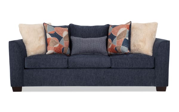 Brynn Navy 91'' transitional sleeper sofa in soft polyester fabric with plush Bob-O-Pedic memory foam cushions and colorful accent pillows.