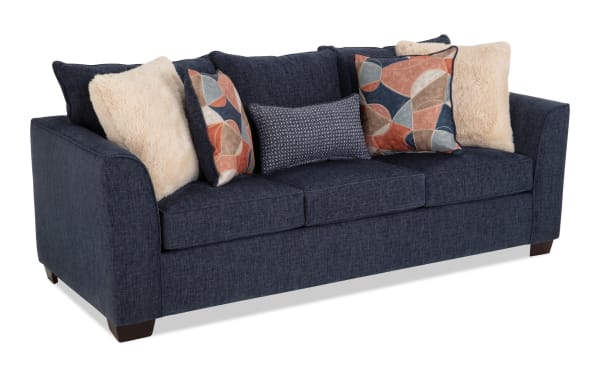 Brynn Navy 91'' transitional sleeper sofa with soft polyester fabric upholstery, Bob-O-Pedic memory foam cushions, and multiple decorative pillows.