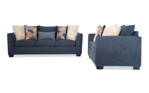Brynn Navy 88'' transitional sleeper sofa and 64'' loveseat set in soft blue polyester fabric with Bob-O-Pedic memory foam cushions and colorful accent pillows.