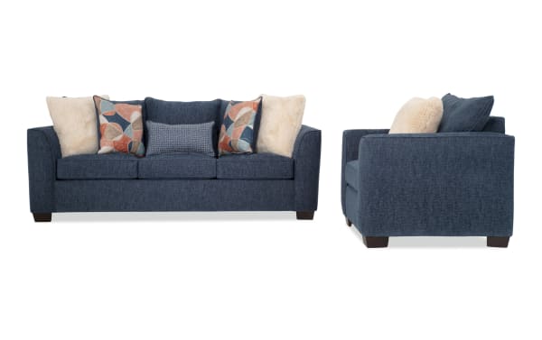 Brynn Navy 88'' transitional sleeper sofa and chair set in soft navy polyester fabric with Bob-O-Pedic memory foam cushions and colorful accent pillows.