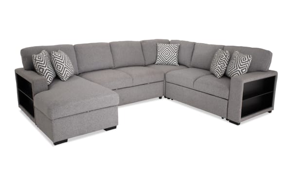 Transitional Playday Gray 119" 4-piece left arm facing chaise sectional in gray polyester fabric with built-in black bookshelf, memory foam cushions, accent pillows, and pop-up sleeper.