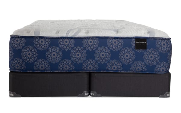 Indulgence 15'' King Plush Split Standard Mattress Set with gel-infused foam, graphite Talalay latex, plush quilt foam, and memory foam on blue floral-patterned sides, paired with black foam-encased split mattress base from Indulgence collection.