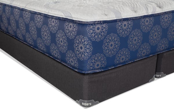 Indulgence 15'' King Plush Split Standard Mattress Set with blue floral-patterned sides, gel-infused foam, memory foam, and split dark gray base labeled "BOB'S."