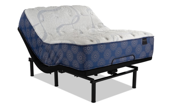 Power Bob Elite Base with Indulgence 15'' Queen Plush Mattress featuring blue patterned sides, white quilted top, adjustable black metal base with USB ports and wireless remote control.