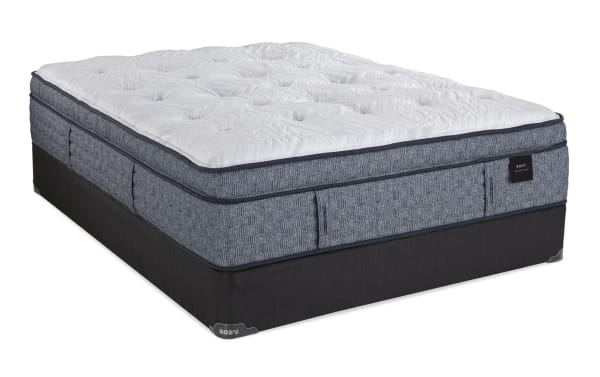 Envy 16'' King Ultra Plush Split Standard Mattress Set with hand-tufted white Tencel knit cover, gray hybrid comfort layers, and black foundation by Bob’s.