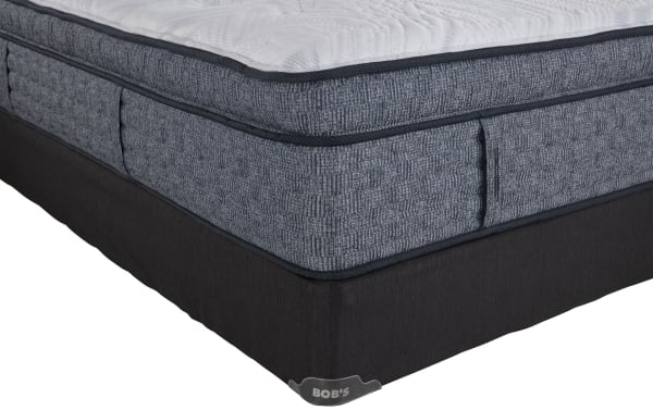 Envy 16'' King Ultra Plush Split Standard Mattress Set by Bob’s, featuring a hand-tufted Tencel knit cover, blue-gray hybrid comfort layers, and black split foundation.