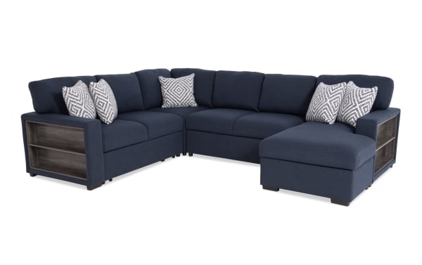 Transitional Playday Navy 119'' 4-piece right-arm facing pop-up sleeper chaise sectional in polyester fabric with built-in bookshelves, USB/USB-C ports, memory foam cushions, storage chaise, and patterned accent pillows.