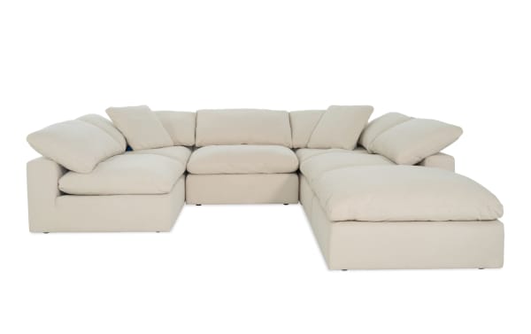 Beige Dream Shell 131'' 6 Piece Modular Sectional with oversized reversible cushions, 3 armless chairs, 2 corners, 1 ottoman in transitional polyester fabric.
