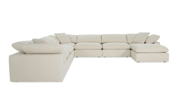 Dream Shell 174'' 8 Piece Modular Sectional in beige polyester fabric with 4 armless chairs, 3 corners, 1 ottoman, and reversible feather blend cushions.
