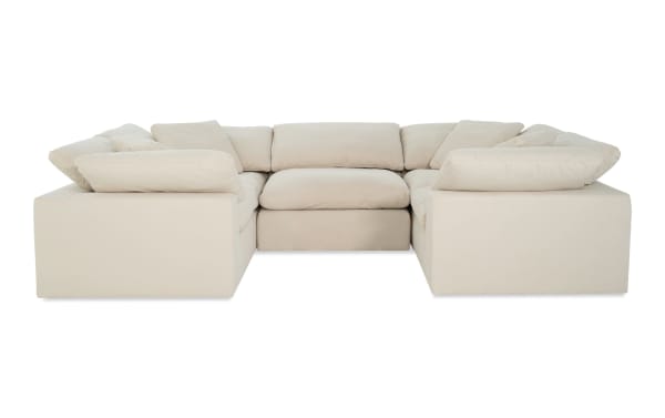 Dream Shell 131'' beige 5-piece modular sectional with 4 corner seats, 1 armless chair, and oversized reversible cushions in soft polyester fabric.
