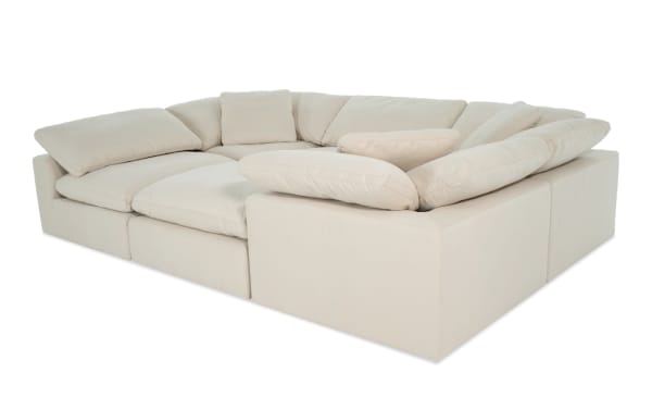 Dream Shell 131'' beige 6-piece modular sectional with 3 corners, 2 armless chairs, and 1 ottoman in soft polyester-nylon fabric, transitional style.