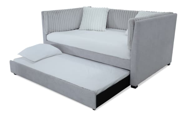 Sofia Twin Gray Upholstered Daybed with Twin Trundle in gray polyester fabric, glam style with channel tufted back cushions and faux fur pillows, featuring a pull-out trundle bed for extra sleeping space.