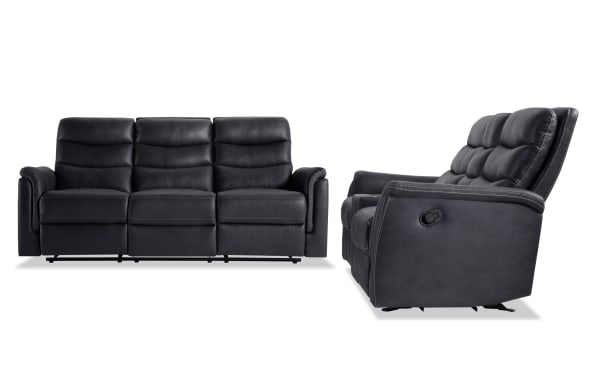 Forte Charcoal 82" manual reclining sofa and 72" gliding console loveseat in gray polyester fabric with padded arms, memory foam seats, and contrasting stitching.
