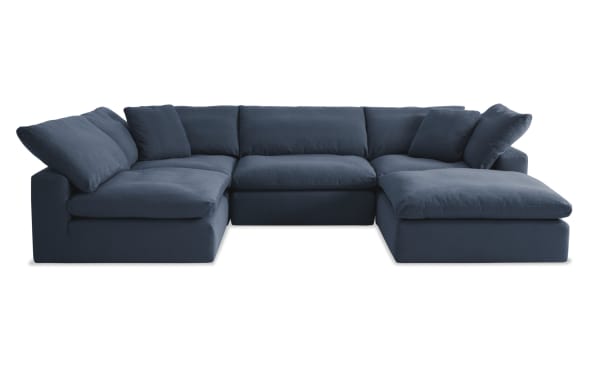 Dream Navy 131'' 5 Piece Modular Sectional in navy blue fabric, transitional style with reversible oversized cushions, 2 armless chairs, 2 corners, and 1 ottoman.