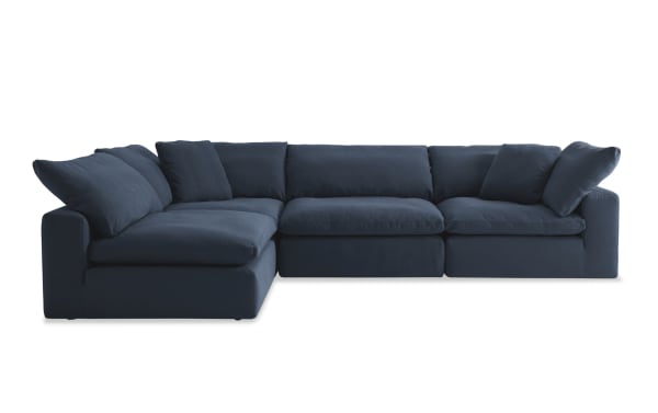 Dream Navy 174'' 4 Piece Modular Sofa in navy blue fabric with 2 corners, 2 armless chairs, transitional style, polyester-nylon blend upholstery, reversible oversized cushions, and feather blend toppers for customizable living room seating.