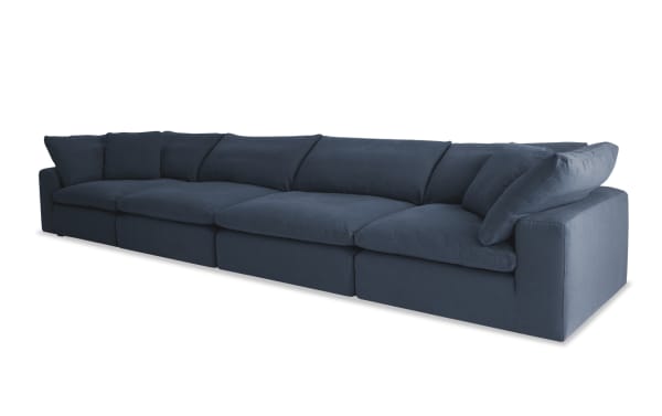 Dream Navy 174'' 4-piece modular sofa in navy blue fabric with 2 corners and 2 armless chairs, transitional style, polyester-nylon blend upholstery, oversized reversible cushions.
