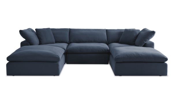 Dream Navy 131'' 5 Piece Modular Sectional in navy blue fabric, transitional style with 2 corners, 2 ottomans, 1 armless chair, polyester blend upholstery, reversible oversized cushions, and feather blend toppers for customizable living room seating.