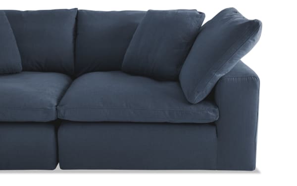 Dream Navy 174'' 8 Piece Modular Sectional with navy polyester fabric, transitional style, featuring oversized reversible cushions and modular design for customizable seating.