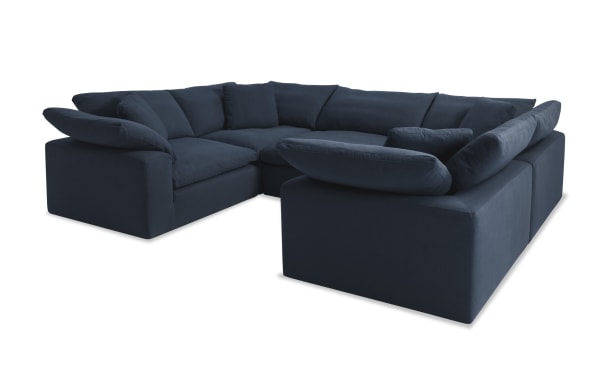 Dream Navy 131'' 5 Piece Modular Sectional in navy blue fabric with four corner seats, one armless chair, and reversible Bob-O-Pedic cushions.