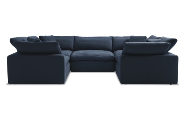 Dream Navy 131'' 5 Piece Modular Sectional with 4 Corners and 1 Armless Chair in navy blue polyester fabric, transitional style, featuring oversized reversible cushions and plush accent pillows.