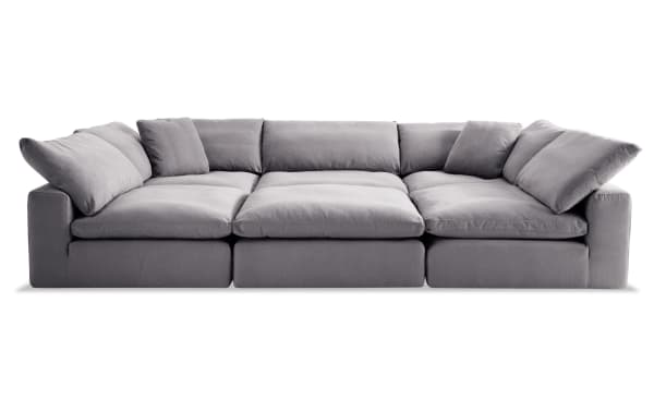 Dream Gray 131'' 6 Piece Modular Sectional in gray fabric with 3 armless chairs, 2 corners, 1 ottoman, reversible cushions, and transitional style.