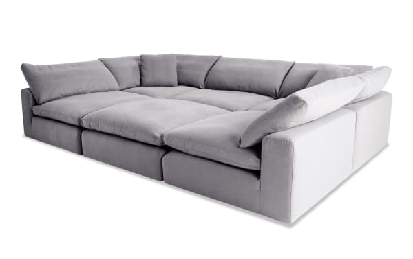 Dream Gray 131'' 6 Piece Modular Sectional in gray polyester fabric with 3 armless chairs, 2 corners, 1 ottoman, oversized reversible cushions, and transitional style.