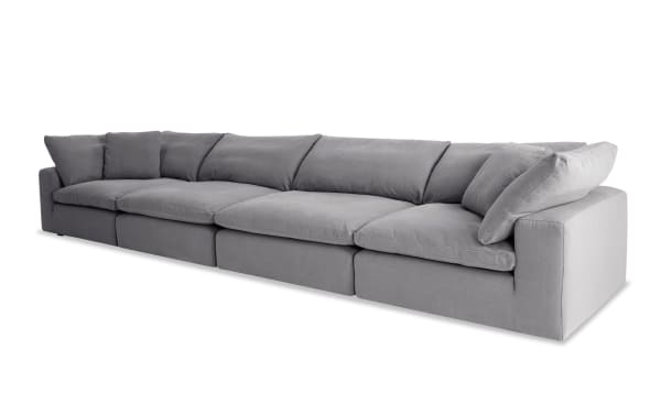 Dream Gray 174'' 4 Piece Modular Sofa with 2 Corners and 2 Armless Chairs in gray polyester fabric. Transitional style with oversized reversible cushions and feather blend toppers for customizable living room seating.