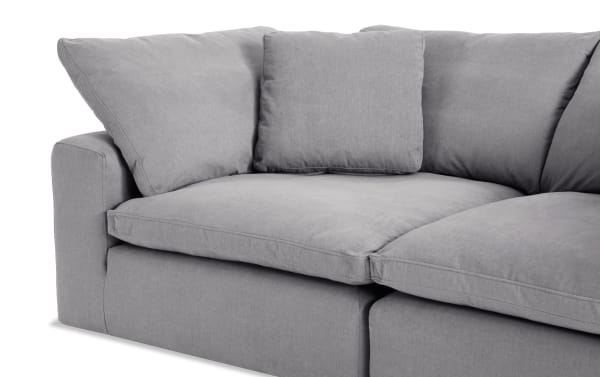 Dream Gray 131'' 9 Piece Modular Sectional with 4 ottomans, 3 armless chairs, 2 corners in gray polyester fabric, transitional style, reversible cushions with feather blend topper.