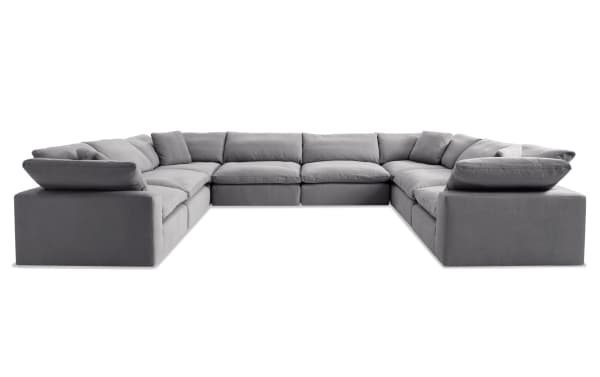 Dream Gray 174'' 8 Piece Modular Sectional in gray polyester fabric, transitional style with reversible oversized cushions and 4 accent pillows.