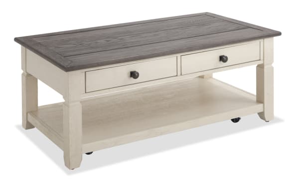 Rustic Laurel White & Brown Storage Coffee Table from Laurel Entertainment & Occasional collection, featuring distressed MDF, rubberwood, acacia veneers, two drawers, and bottom shelf for storage.