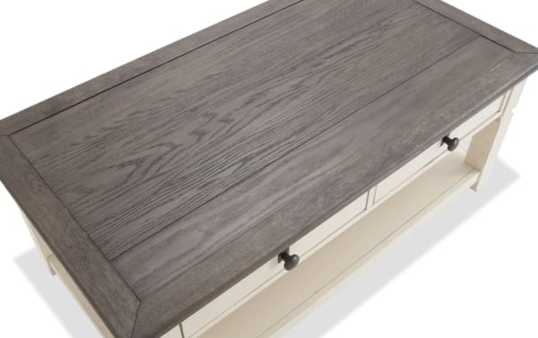 Rustic Laurel Entertainment & Occasional coffee table with distressed brown acacia veneer top, white rubberwood base, and two storage drawers.