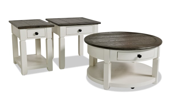 Laurel White & Brown Round Storage Coffee Table with End & Chairside Tables, MDF farmhouse set with distressed dark wood tops, drawers, and light finish.