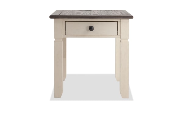 Laurel White & Brown cottage-style end table with MDF, rubberwood, and acacia veneers, featuring a distressed two-tone finish and dark hardware.