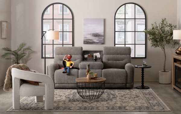Transitional Phantom Gray 86'' power reclining sofa and recliner set in plush gray polyester fabric with built-in USB and USB-C ports, featuring memory foam cushions.