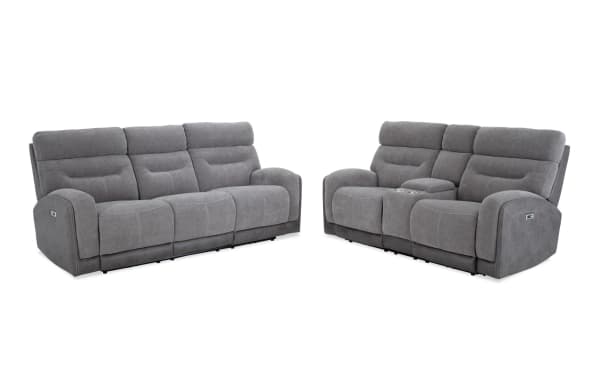 Phantom Gray 86" power reclining sofa and 76" console loveseat in gray polyester fabric, transitional style with USB and USB-C ports, plush cushioning, and memory foam seating.