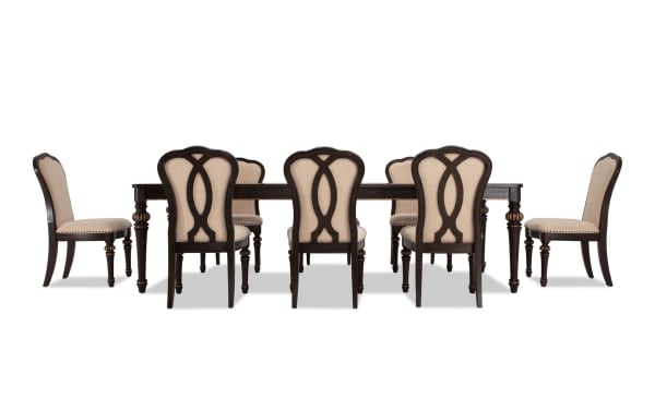 Regency 9 Piece Brown & Beige Upholstered Extendable Dining Set with traditional fluted legs, beige polyester fabric, oak veneer table, and cushioned chairs.