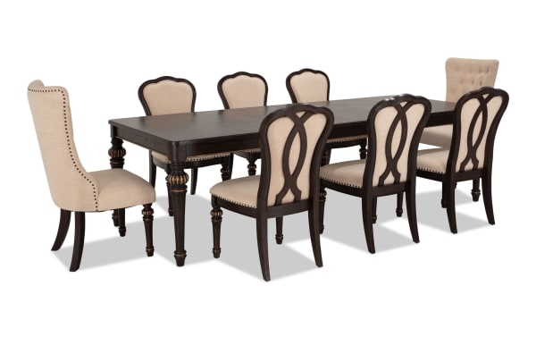 Regency 9 Piece Brown & Beige Upholstered Extendable Dining Set with traditional fluted legs, beige polyester fabric chairs, and oak veneer table.