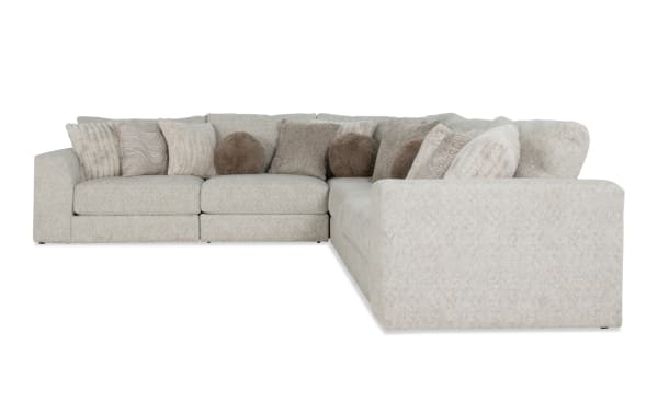 Posh Beige 134" 5-piece modular sectional with plush polyester fabric upholstery, Bob-O-Pedic gel memory foam, and 14 assorted beige accent pillows in transitional style.