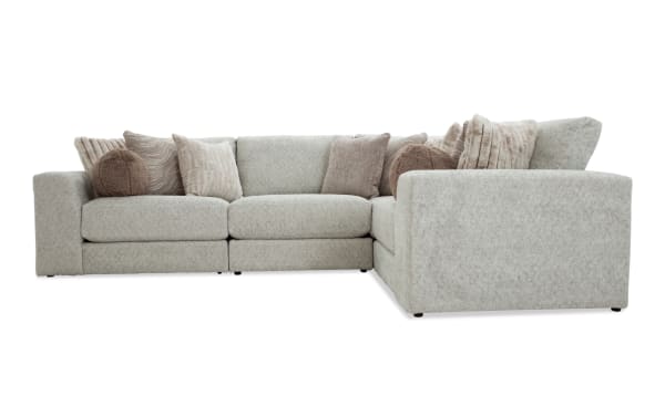 Posh Beige 139'' 4 Piece Modular Sectional in transitional style with plush beige polyester fabric, gel-infused memory foam cushions, and 13 accent pillows.