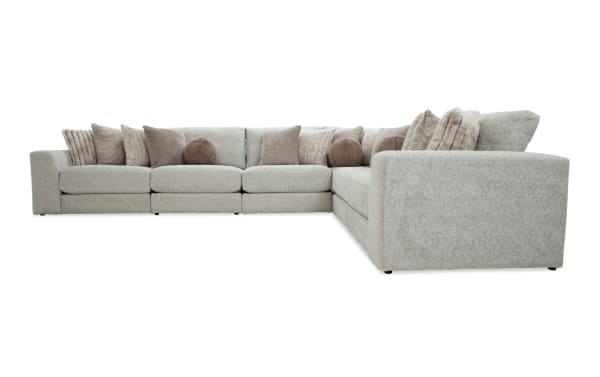 Posh Beige 172'' 6-piece modular sectional in transitional style with plush beige polyester fabric, Bob-O-Pedic gel memory foam, and 15 accent pillows.
