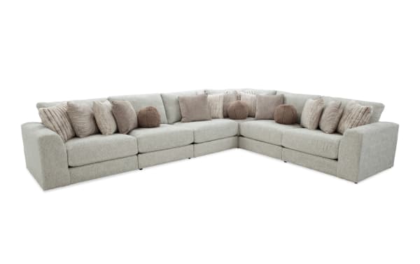 Posh Beige 172'' 6-piece modular sectional in transitional style with plush beige polyester fabric, includes 3 armless chairs, corner, left and right arm facing chairs, and 15 assorted accent pillows.