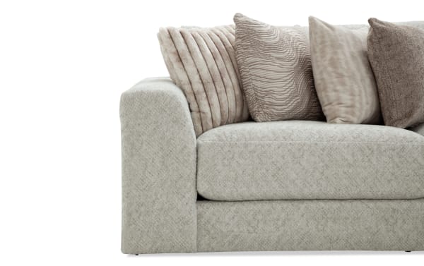 Beige Posh 172'' 6-piece modular sectional with plush polyester fabric, transitional style, and multiple textured beige accent pillows.