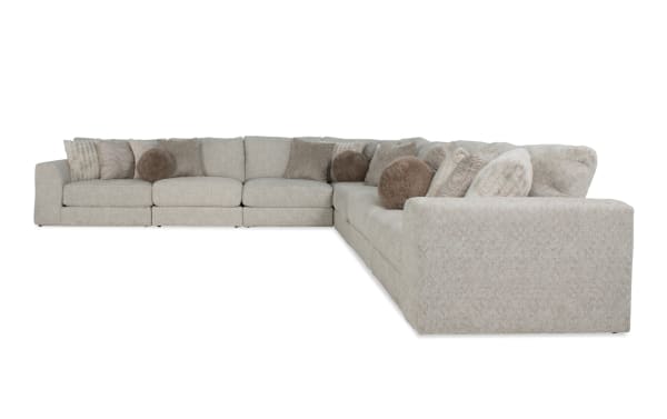 Posh Beige 172'' 7-piece modular sectional with plush beige polyester fabric, transitional style, including 4 armless chairs, corner, left and right arm facing chairs, and 16 accent pillows for a cozy living room centerpiece.
