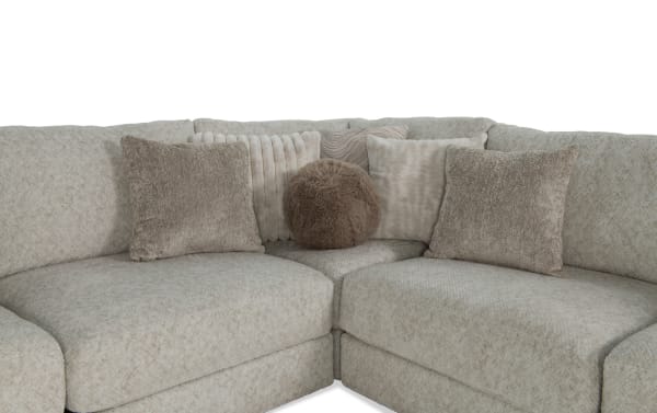 Beige Posh 7-piece modular sectional with plush polyester fabric, transitional style, featuring 16 assorted accent pillows and memory foam cushions.