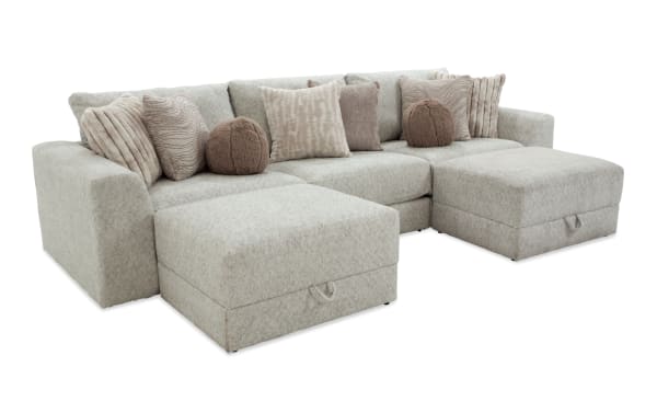 Posh Beige 139'' 5-piece modular sofa with plush polyester fabric upholstery, transitional style, includes 2 ottomans, armless, left and right arm chairs, and nine accent pillows.