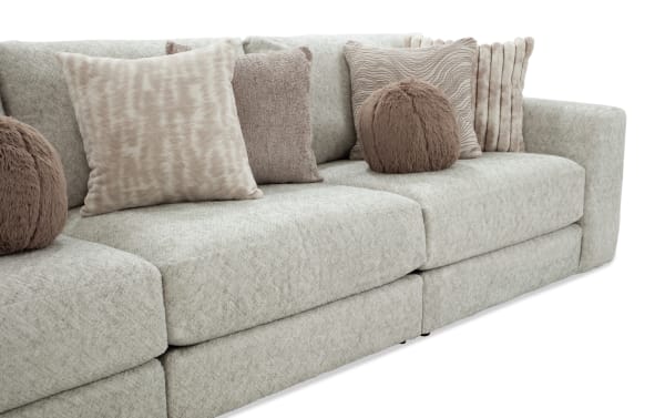 Posh Beige 139'' 5 Piece Modular Sofa with plush beige polyester fabric, nine accent pillows, and gel-infused memory foam cushions in transitional style.