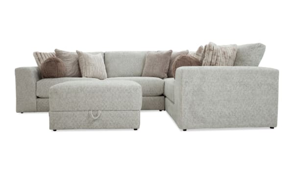Posh Beige 134'' 4-piece modular sectional with beige polyester fabric upholstery, transitional style, includes 13 accent pillows and storage ottoman.